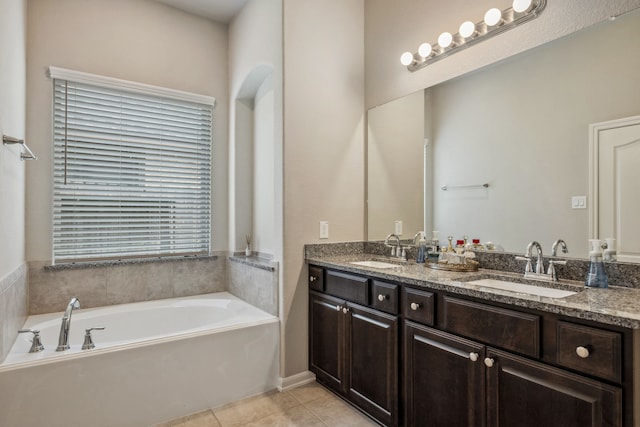 237 Catoti Cay Ct, Conroe, TX 77304 - bathroom featuring tile patterned flooring, a garden tub, and double vanity