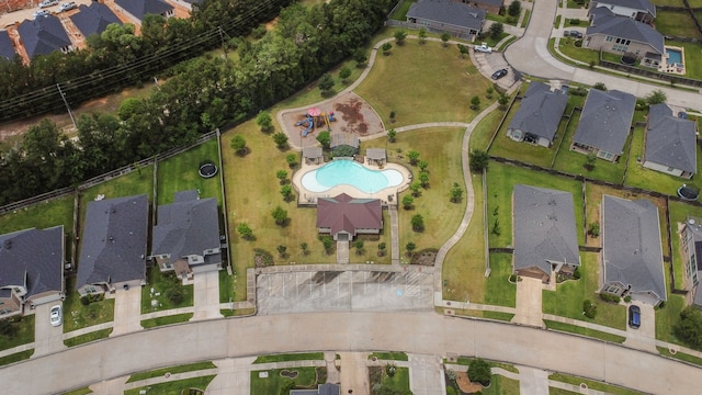 237 Catoti Cay Ct, Conroe, TX 77304 - aerial overview of property's location featuring a pool and nearby suburban area