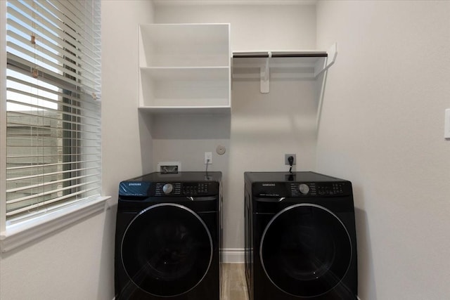 laundry area featuring washing machine and clothes dryer