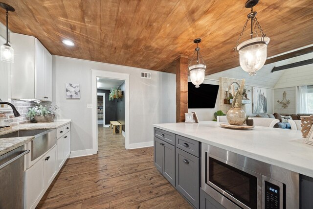 41103 Mill Creek Rd, Magnolia, TX 77354 - kitchen featuring wooden ceiling, a sink, stainless steel appliances, gray cabinetry, and baseboards