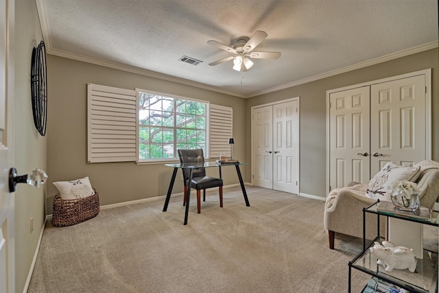 office with ceiling fan, light colored carpet, baseboards, ornamental molding, and a textured ceiling