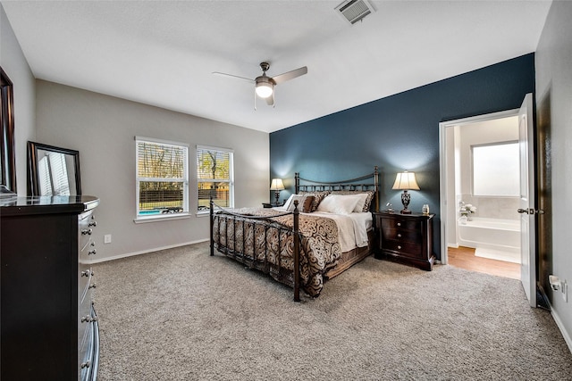 bedroom featuring carpet, ceiling fan, baseboards, and connected bathroom