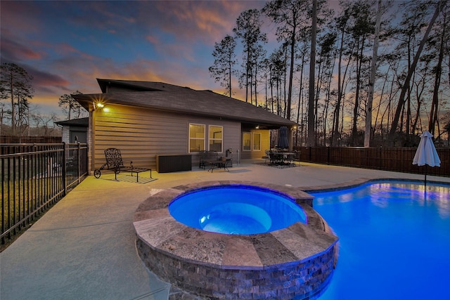 view of swimming pool with a patio, a fenced backyard, outdoor dining area, and a pool with connected hot tub