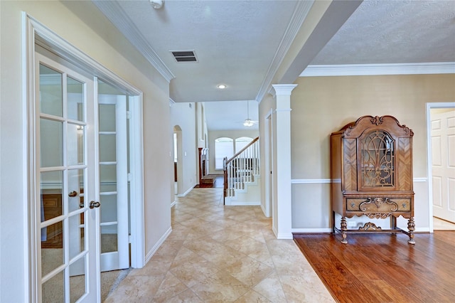 14022 Ashland Landing Dr, Cypress, TX 77429 - hall with ornamental molding, arched walkways, french doors, stairs, and ornate columns
