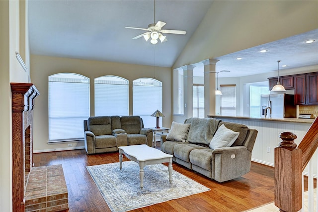 14022 Ashland Landing Dr, Cypress, TX 77429 - living area with a ceiling fan, hardwood / wood-style flooring, recessed lighting, ornate columns, and high vaulted ceiling