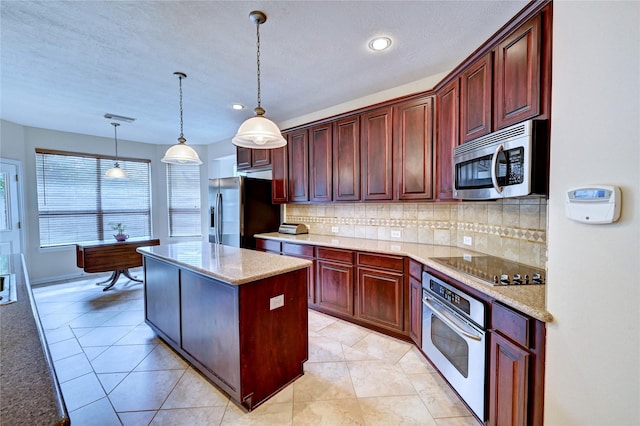 14022 Ashland Landing Dr, Cypress, TX 77429 - kitchen featuring appliances with stainless steel finishes, a center island, decorative backsplash, pendant lighting, and recessed lighting