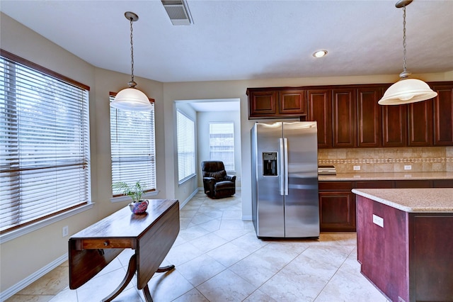 14022 Ashland Landing Dr, Cypress, TX 77429 - kitchen with stainless steel fridge with ice dispenser, decorative light fixtures, backsplash, baseboards, and recessed lighting