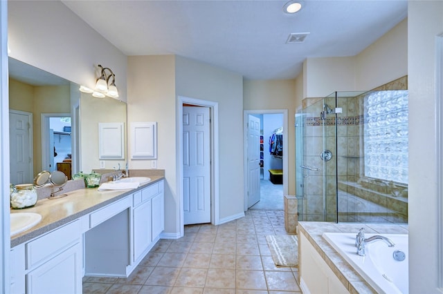 14022 Ashland Landing Dr, Cypress, TX 77429 - bathroom featuring a spacious closet, double vanity, a shower stall, a bath, and tile patterned flooring