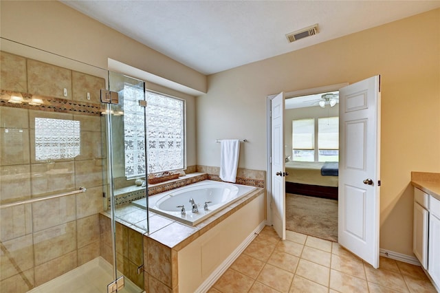 14022 Ashland Landing Dr, Cypress, TX 77429 - bathroom with a bath, vanity, a shower stall, tile patterned floors, and ensuite bath