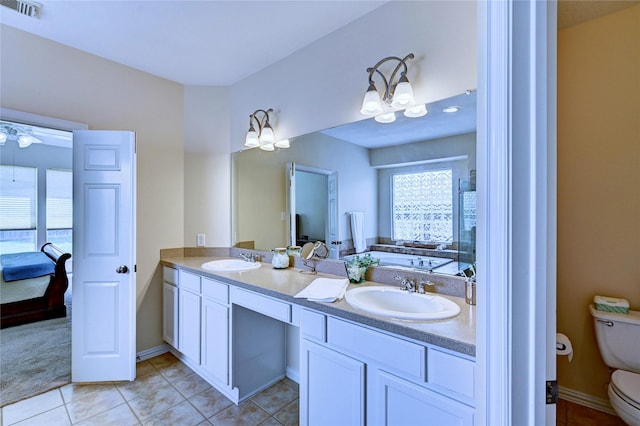 14022 Ashland Landing Dr, Cypress, TX 77429 - ensuite bathroom with toilet, double vanity, tile patterned floors, and a bath