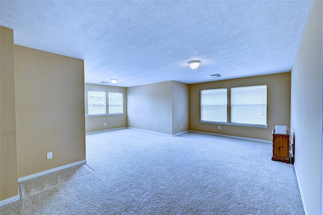 14022 Ashland Landing Dr, Cypress, TX 77429 - carpeted spare room featuring baseboards and a textured ceiling
