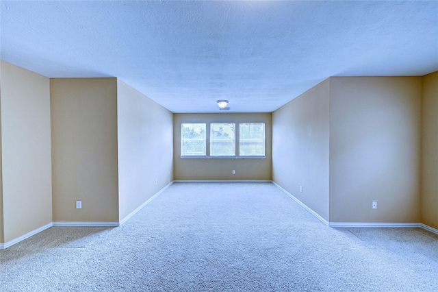 14022 Ashland Landing Dr, Cypress, TX 77429 - carpeted empty room with baseboards and a textured ceiling