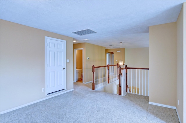 14022 Ashland Landing Dr, Cypress, TX 77429 - carpeted empty room featuring baseboards and a chandelier