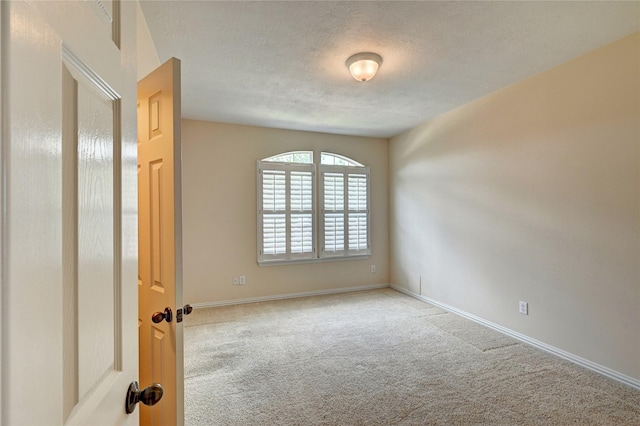 14022 Ashland Landing Dr, Cypress, TX 77429 - unfurnished room with carpet floors, a textured ceiling, and baseboards