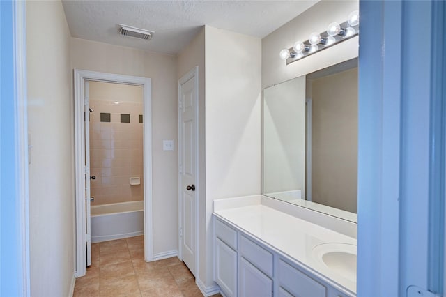 14022 Ashland Landing Dr, Cypress, TX 77429 - full bathroom featuring vanity, tile patterned flooring, shower / tub combination, baseboards, and a textured ceiling