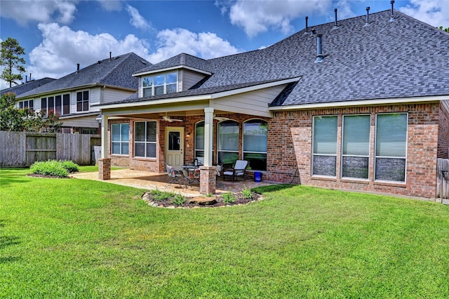 14022 Ashland Landing Dr, Cypress, TX 77429 - back of house featuring brick siding, roof with shingles, and a patio
