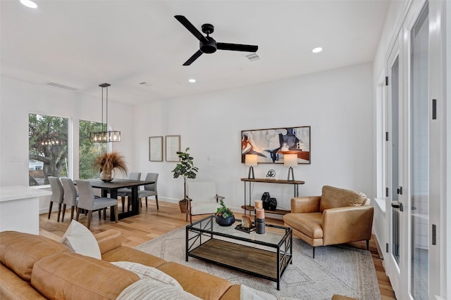 9428 Campbell Rd Unit B, Houston, TX 77080 - living room featuring a chandelier, light wood-style floors, recessed lighting, ceiling fan, and baseboards