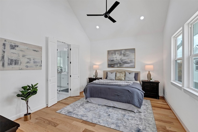 9428 Campbell Rd Unit B, Houston, TX 77080 - bedroom with high vaulted ceiling, wood finished floors, connected bathroom, baseboards, and ceiling fan