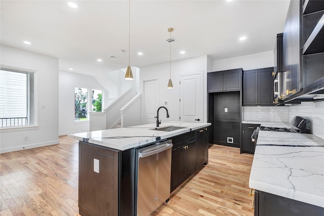 9428 Campbell Rd Unit B, Houston, TX 77080 - kitchen with dishwasher, a sink, light wood finished floors, backsplash, and gas range