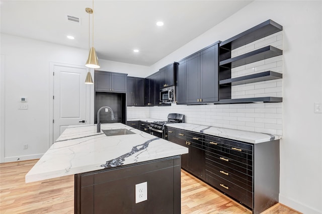 9428 Campbell Rd Unit B, Houston, TX 77080 - kitchen with appliances with stainless steel finishes, a sink, open shelves, light wood finished floors, and light stone countertops