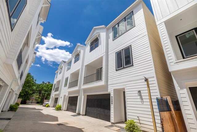 9428 Campbell Rd Unit B, Houston, TX 77080 - view of building exterior with a garage and driveway