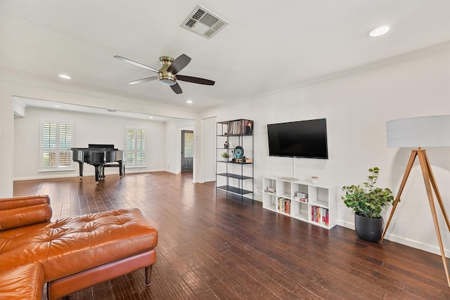 living area with a ceiling fan, hardwood / wood-style floors, ornamental molding, baseboards, and recessed lighting