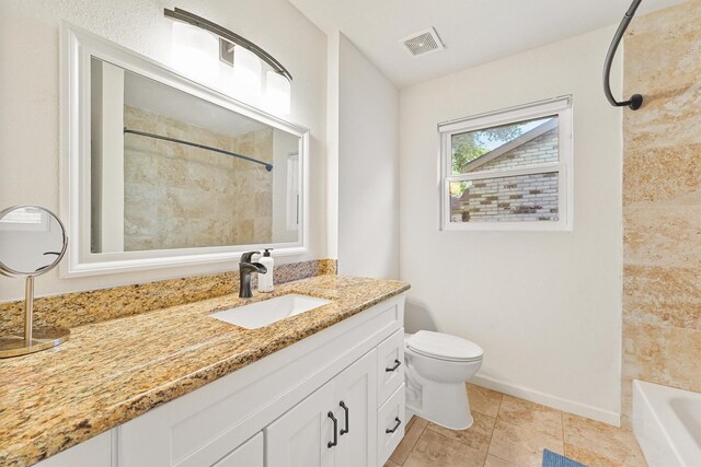 full bath featuring toilet, tile patterned floors, vanity, and baseboards