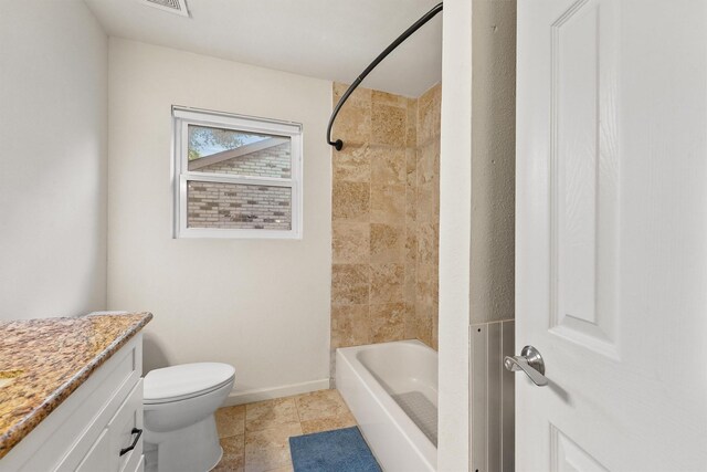 bathroom featuring vanity, toilet, shower / tub combination, baseboards, and tile patterned floors