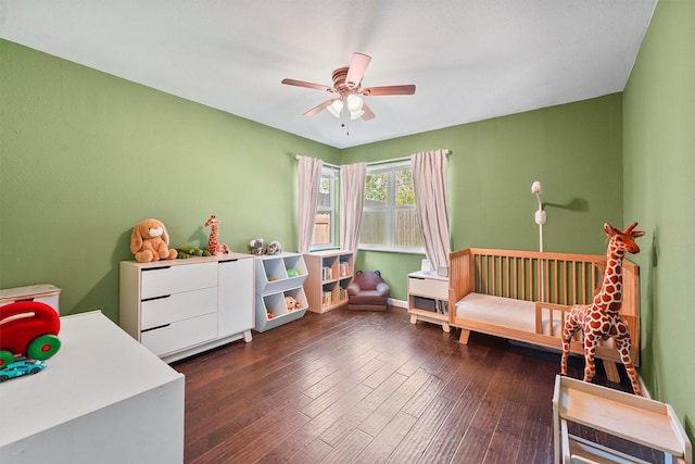 bedroom with dark wood-style floors and ceiling fan