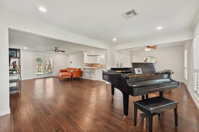 sitting room featuring a ceiling fan, ornamental molding, wood finished floors, recessed lighting, and baseboards