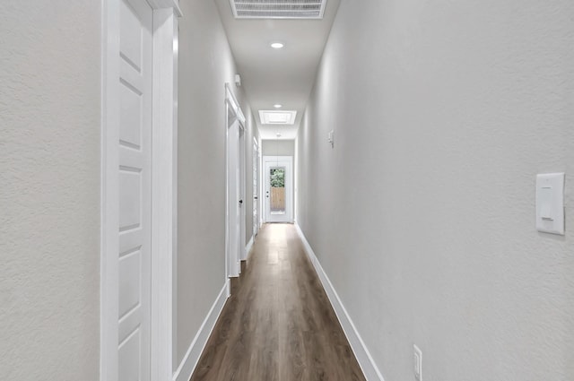 206 S 4th St, Conroe, TX 77301 - corridor featuring dark wood-style floors, baseboards, recessed lighting, and a textured wall