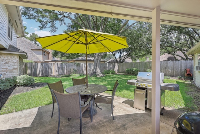 view of patio featuring grilling area and outdoor dining area