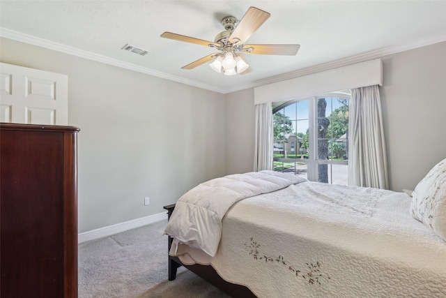 carpeted bedroom with ornamental molding, baseboards, and a ceiling fan