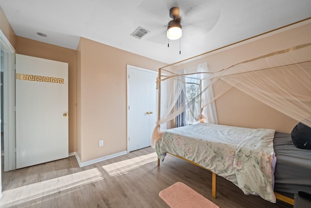16815 Watering Oaks Ln, Houston, TX 77083 - bedroom with wood finished floors, ceiling fan, vaulted ceiling, and baseboards