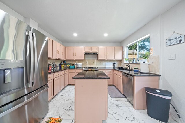 16815 Watering Oaks Ln, Houston, TX 77083 - kitchen featuring appliances with stainless steel finishes, a sink, a center island, light marble finish flooring, and recessed lighting