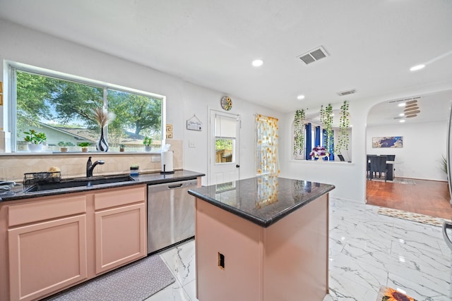 16815 Watering Oaks Ln, Houston, TX 77083 - kitchen with dishwasher, a sink, plenty of natural light, a center island, and recessed lighting