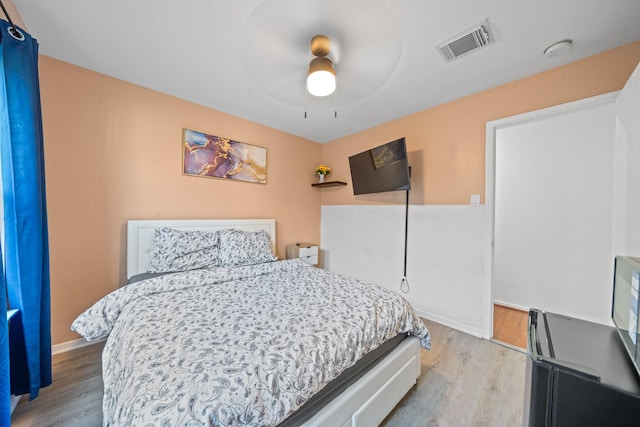 16815 Watering Oaks Ln, Houston, TX 77083 - bedroom featuring light wood finished floors, baseboards, and ceiling fan