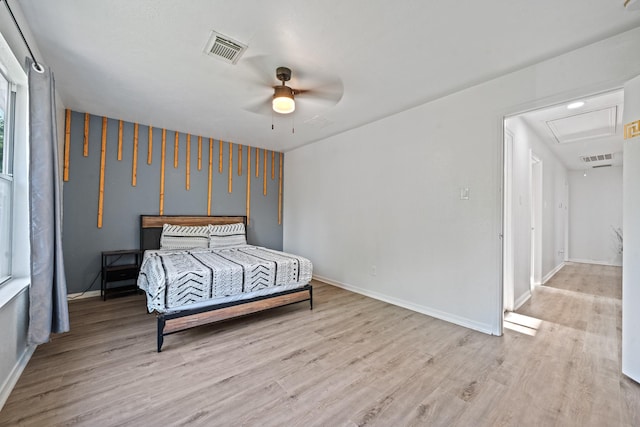 16815 Watering Oaks Ln, Houston, TX 77083 - bedroom with attic access, wood finished floors, and baseboards
