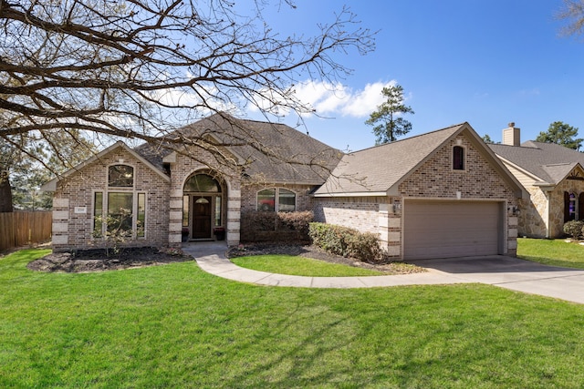french country style house with brick siding, driveway, an attached garage, and a shingled roof