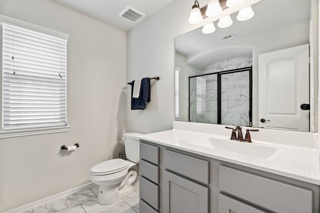 full bathroom featuring marble finish flooring, a marble finish shower, toilet, baseboards, and vanity