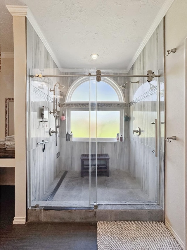 103 Deer Trl, Lake Jackson, TX 77566 - full bath with crown molding, a textured ceiling, and a shower stall