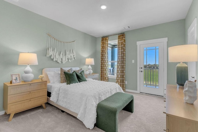 21705 Southern Valley Ln, New Caney, TX 77357 - bedroom with access to exterior, light colored carpet, baseboards, and recessed lighting