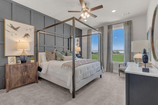 21705 Southern Valley Ln, New Caney, TX 77357 - bedroom featuring light carpet, a decorative wall, recessed lighting, and a ceiling fan