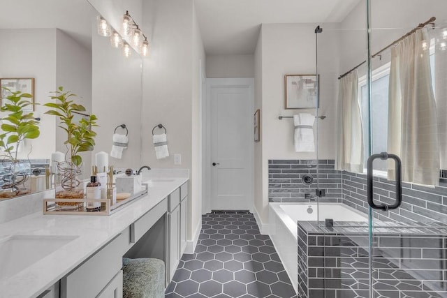 21705 Southern Valley Ln, New Caney, TX 77357 - full bathroom with double vanity, a garden tub, a shower stall, tile patterned flooring, and baseboards