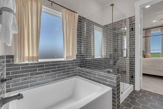21705 Southern Valley Ln, New Caney, TX 77357 - bathroom with a garden tub, a shower stall, connected bathroom, tile patterned flooring, and recessed lighting