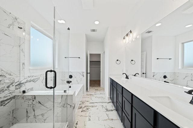 21705 Southern Valley Ln, New Caney, TX 77357 - bathroom with marble finish flooring, double vanity, a marble finish shower, a garden tub, and a walk in closet
