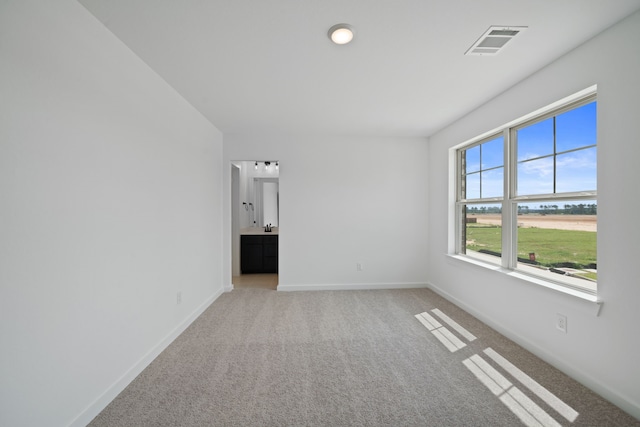21705 Southern Valley Ln, New Caney, TX 77357 - unfurnished room featuring light carpet and baseboards