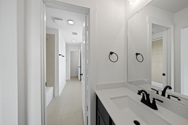 21705 Southern Valley Ln, New Caney, TX 77357 - bathroom featuring tile patterned flooring, vanity, and shower / tub combination