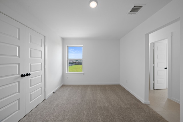 21705 Southern Valley Ln, New Caney, TX 77357 - unfurnished bedroom featuring light colored carpet and baseboards