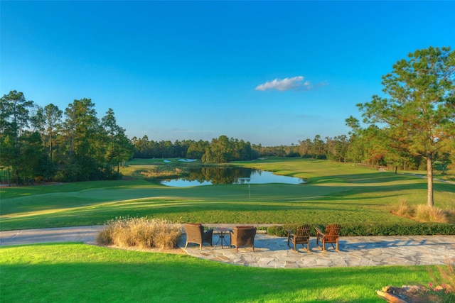 30 Johnathan Landing Ct, Spring, TX 77389 - view of home's community featuring a water view, a yard, view of golf course, and view of scattered trees